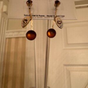 Delicate custom jewellery drop earrings in amber color stones and rhinestones